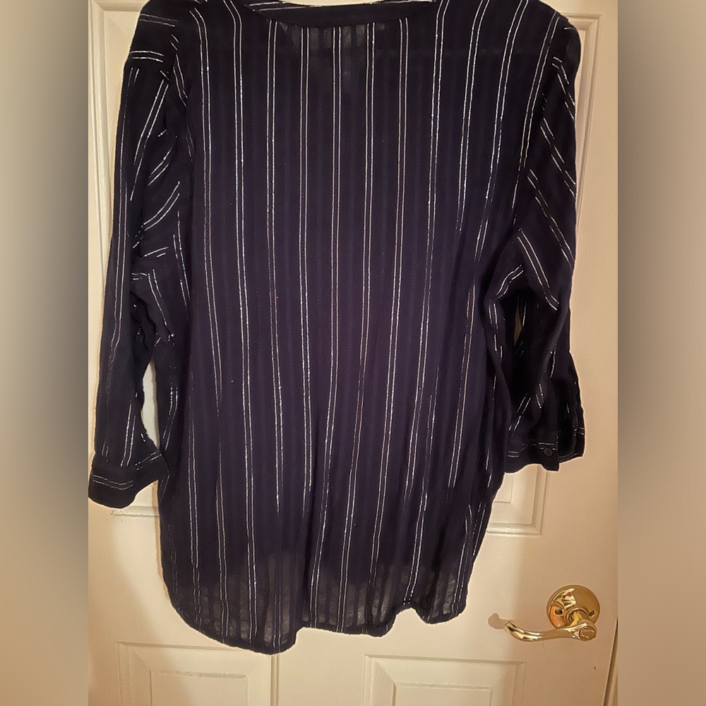 Blue cotton shirt with silver threads running through. Very pretty.